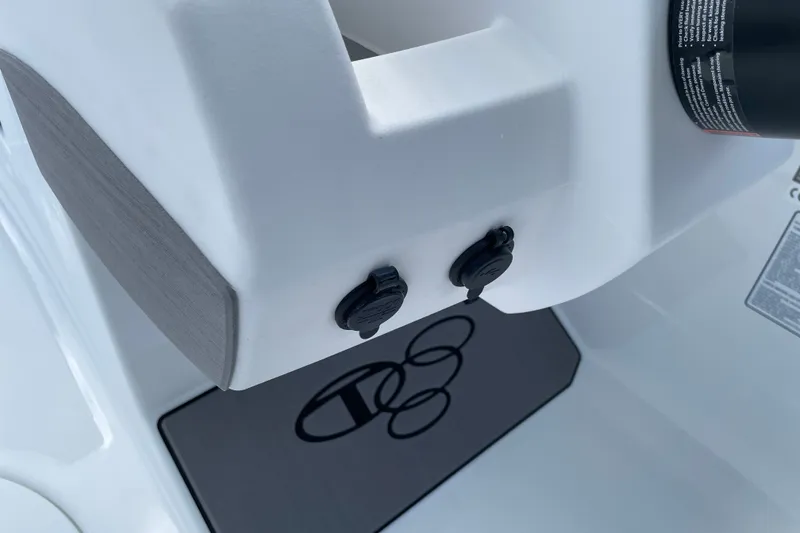 Slide: The Image of 2027 Tahoe T21 boat interior detail with dual ports and logo mat. - 7