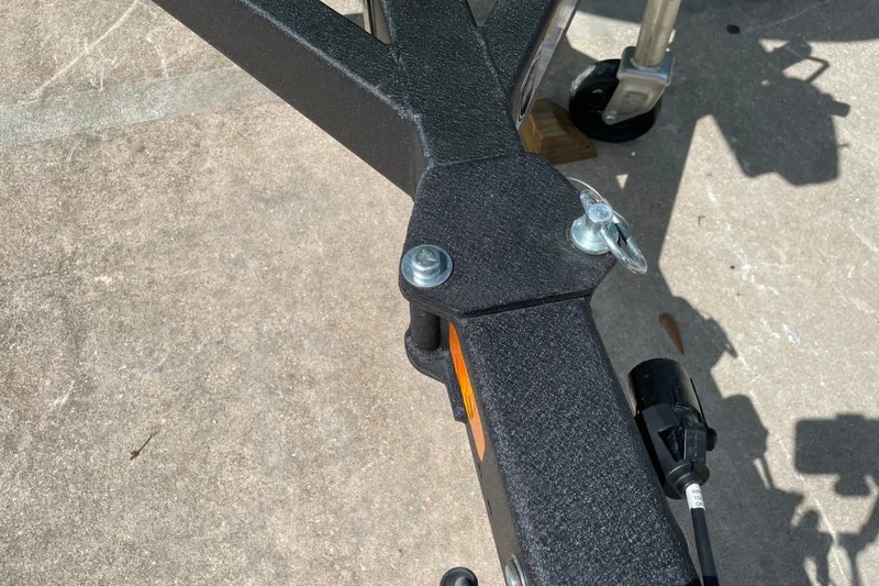 Slide: The Image of Trailer hitch of a 2027 Tahoe T21 on concrete surface. - 30
