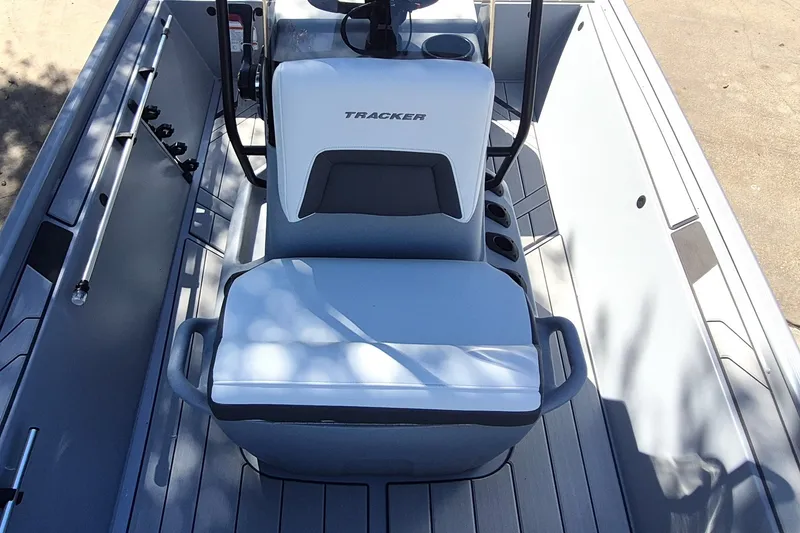 Slide: The Image of 2027 Tracker Bass Tracker Classic CC boat interior with seating and rod holders. - 15