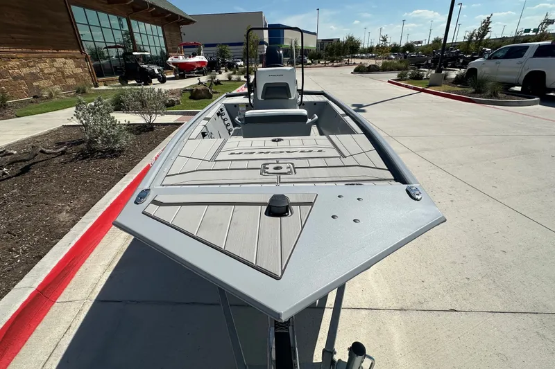 Slide: The Image of 2027 Tracker Bass Tracker Classic CC boat displayed outdoors on a sunny day. - 13