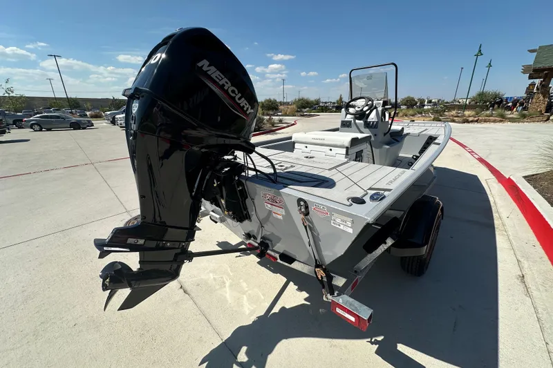 Slide: The Image of 2027 Tracker Bass Tracker Classic CC boat with Mercury outboard motor in a parking lot. - 14