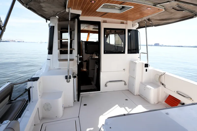 Slide: The Image of 2021 Cutwater C-32 CB boat interior with open cabin and waterfront view. - 21