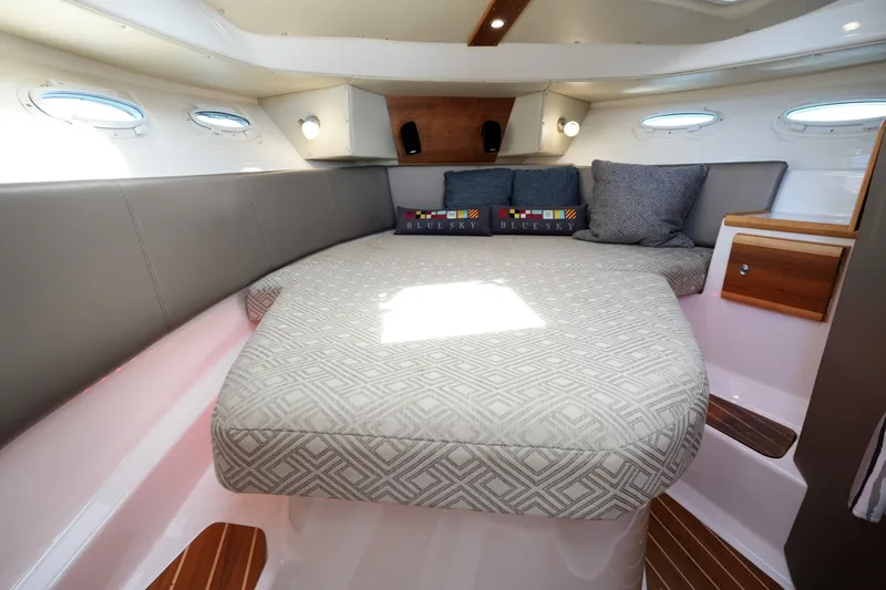 Slide: The Image of Luxurious interior cabin of 2021 Cutwater C-32 CB boat with cozy bedding and cushions. - 43