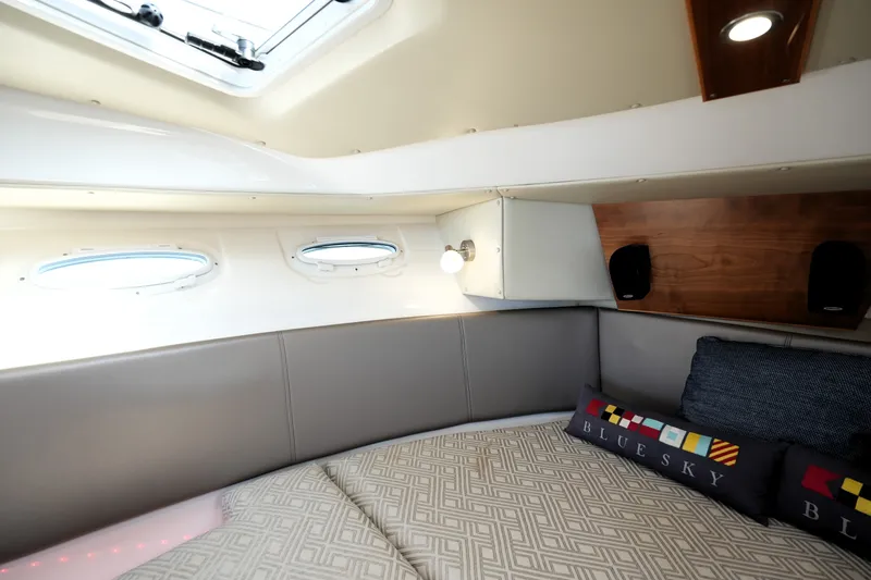 Slide: The Image of 2021 Cutwater C-32 CB cabin interior with cozy seating and decorative pillows. - 45