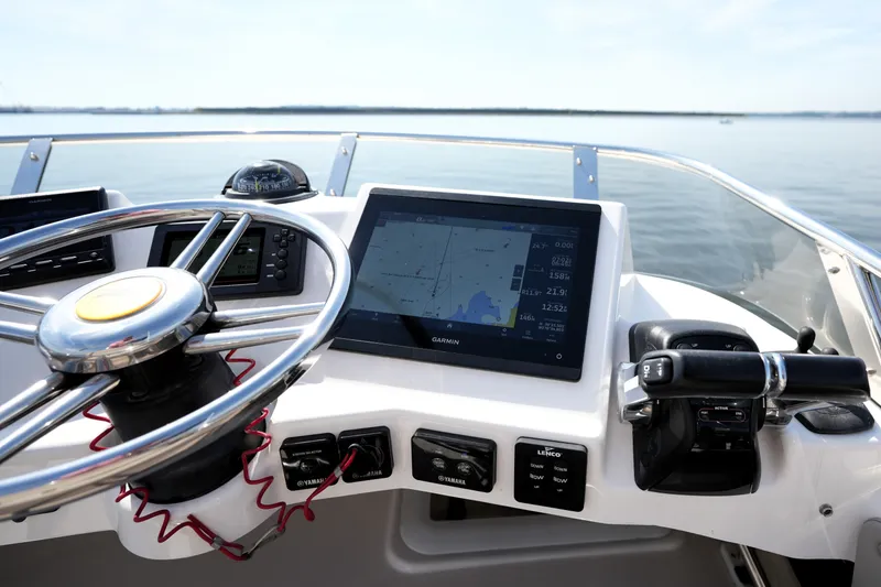 Slide: The Image of 2021 Cutwater C-32 CB boat helm with Garmin navigation system and steering wheel. - 25
