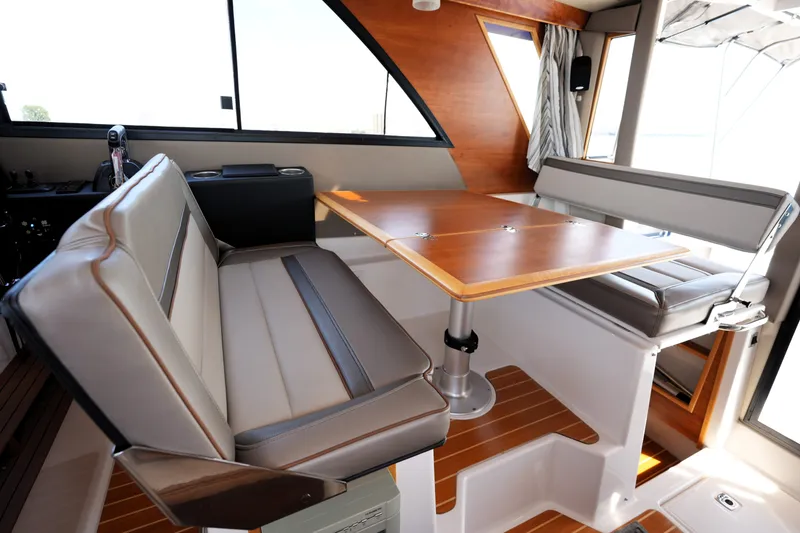 Slide: The Image of Interior of 2021 Cutwater C-32 CB boat with seating and wooden table. - 34
