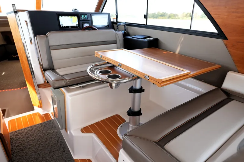 Slide: The Image of Interior of 2021 Cutwater C-32 CB boat with seating and wooden table. - 33