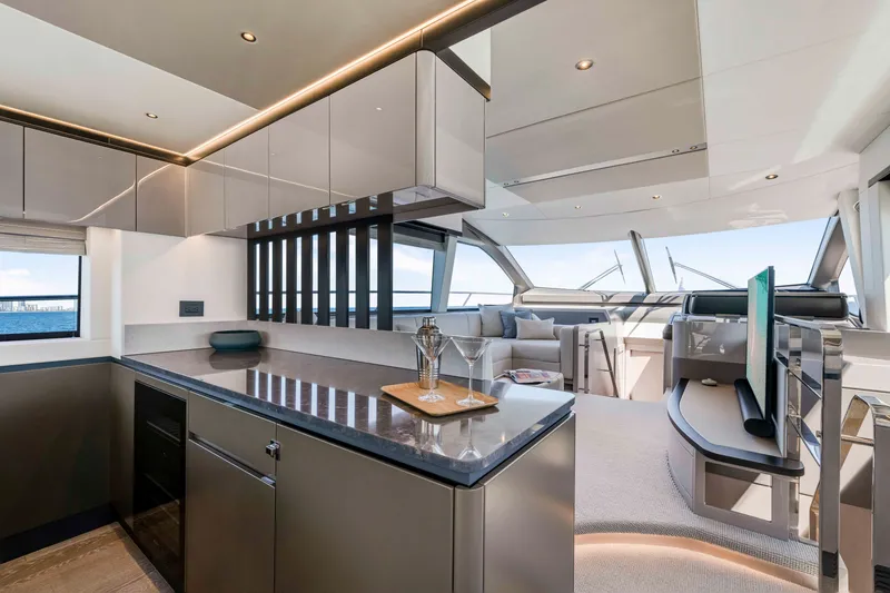 Slide: The Image of The luxurious interior of the 2027 Sunseeker Manhattan 68 features a modern kitchen and sleek living area. - 19