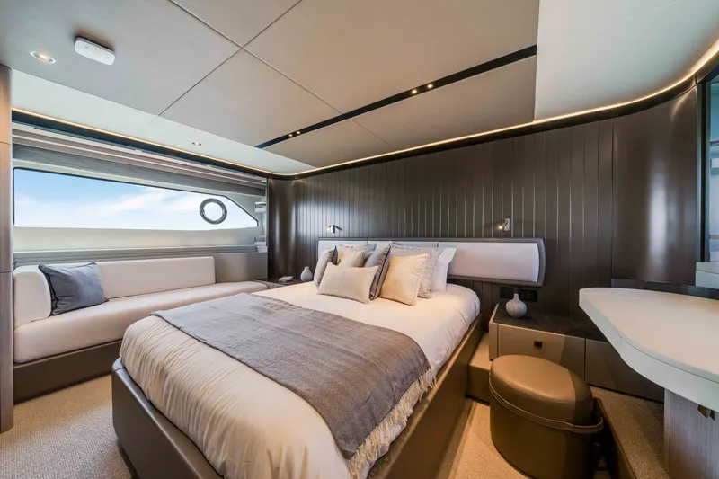 Slide: The Image of Luxurious bedroom on a Sunseeker Manhattan 68 yacht, featuring a large bed and elegant decor. - 35