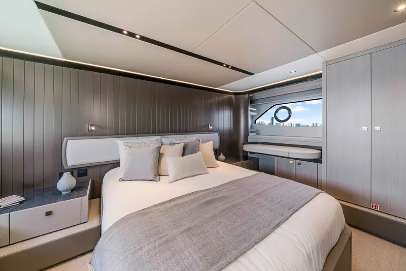 Slide: The Image of Luxurious bedroom on a Sunseeker Manhattan 68 yacht, featuring modern design and large windows. - 36