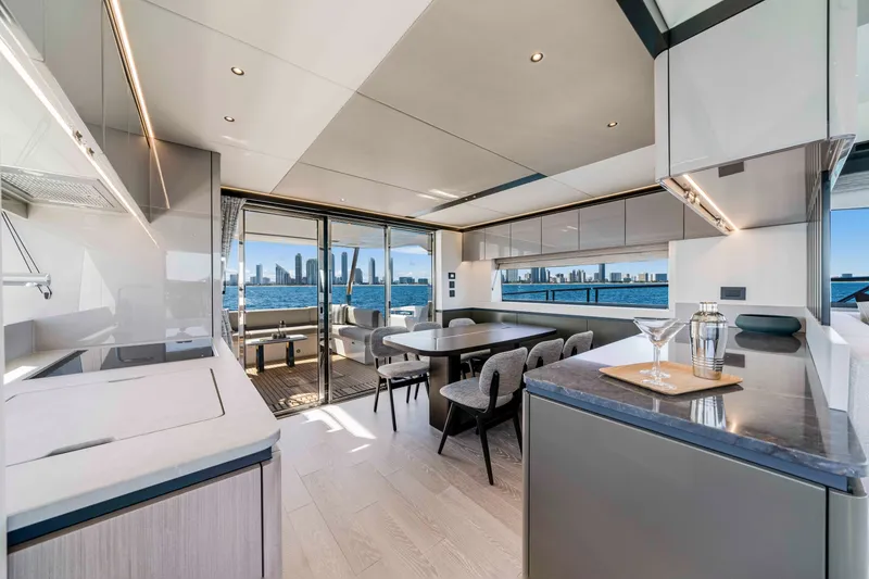 Slide: The Image of Interior of a luxury yacht with modern design, dining area, and skyline view. - 18