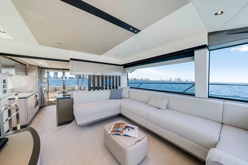 Slide: The Image of Interior of a luxury yacht with white sofas and large windows overlooking the sea. - 22