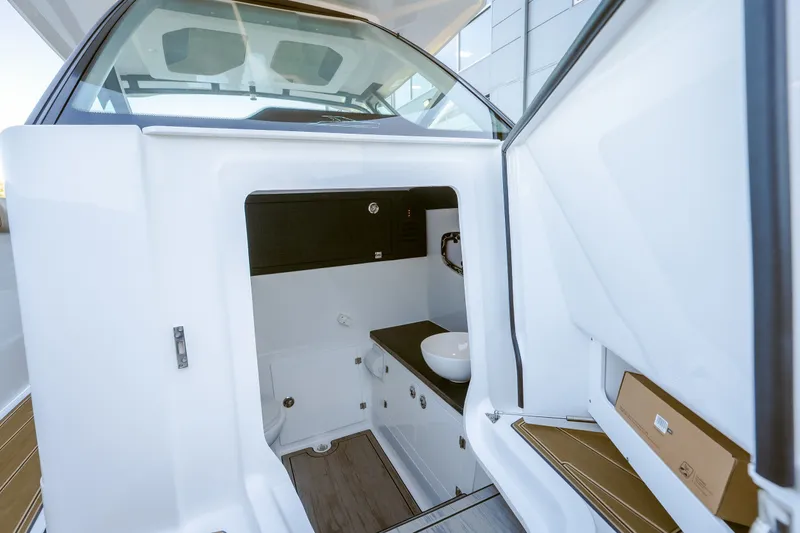 Slide: The Image of Interior view of 2027 Monterey Elite 30 OB boat cabin with modern amenities. - 20