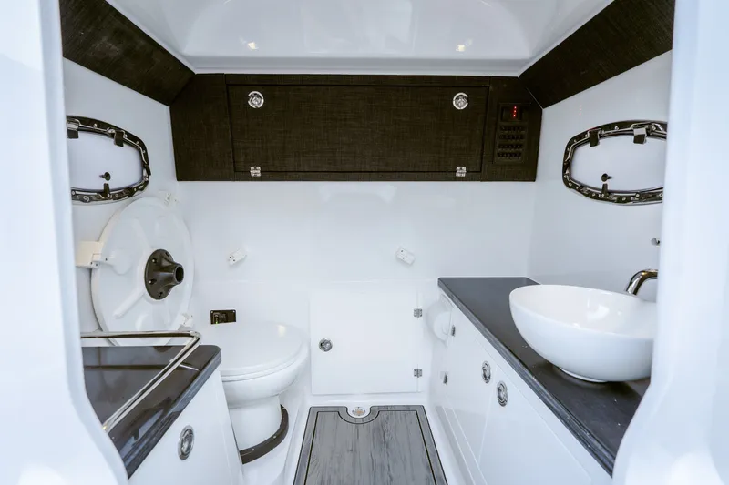 Slide: The Image of Luxurious bathroom interior of 2027 Monterey Elite 30 OB boat, featuring modern fixtures and sleek design. - 21