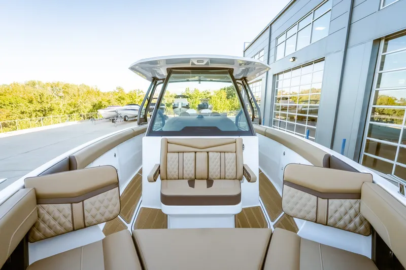 Slide: The Image of 2027 Monterey Elite 30 OB boat interior with luxurious seating and modern design. - 38