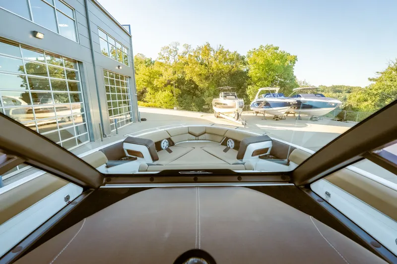 Slide: The Image of Interior view of 2027 Monterey Elite 30 OB boat, showcasing luxurious seating and modern design. - 33