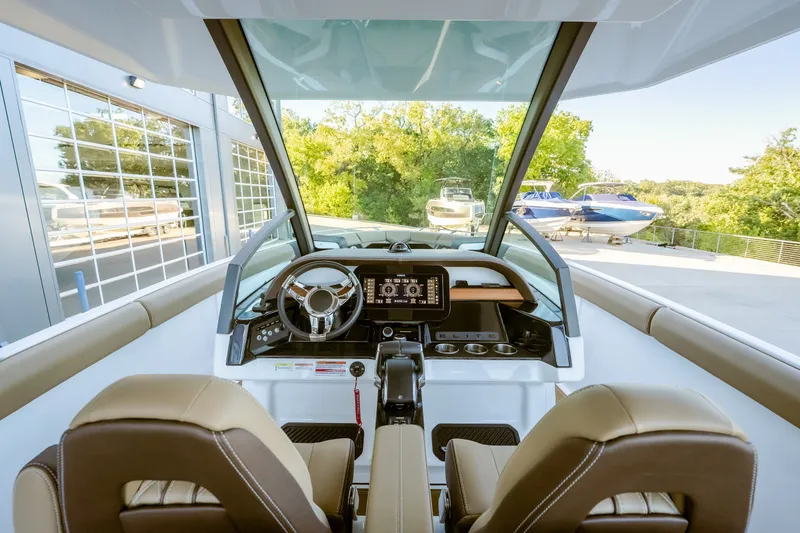 Slide: The Image of 2027 Monterey Elite 30 OB boat interior with modern dashboard and steering wheel. - 27