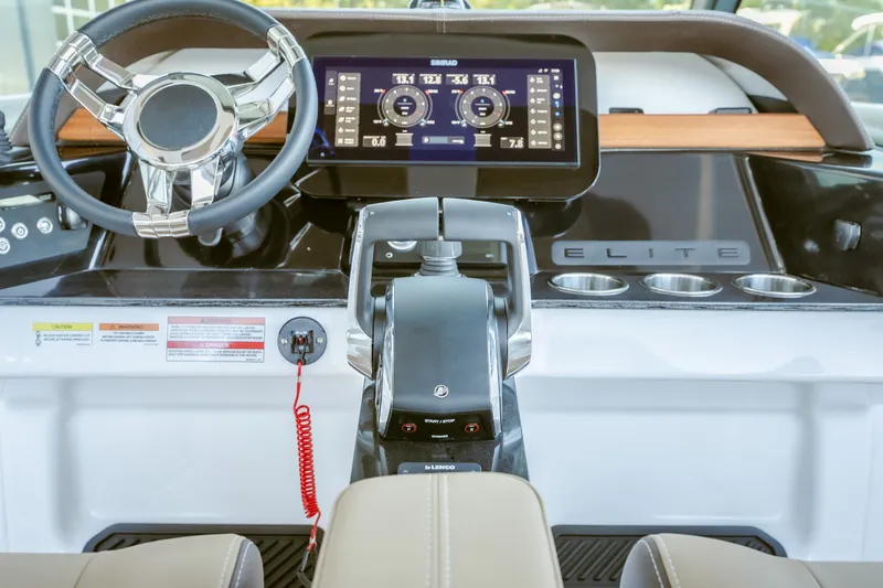 Slide: The Image of Cockpit of 2027 Monterey Elite 30 OB boat with modern steering and digital display. - 28