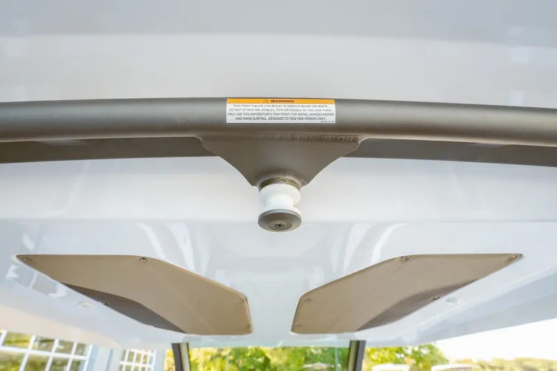 Slide: The Image of 2027 Monterey Elite 30 OB boat interior detail with warning label and ceiling fixtures. - 18