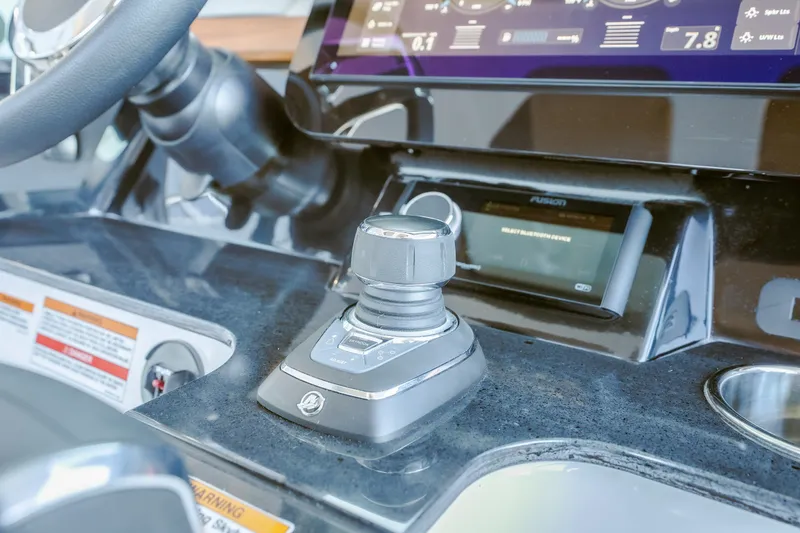 Slide: The Image of Control panel of 2027 Monterey Elite 30 OB boat with joystick and display screen. - 23