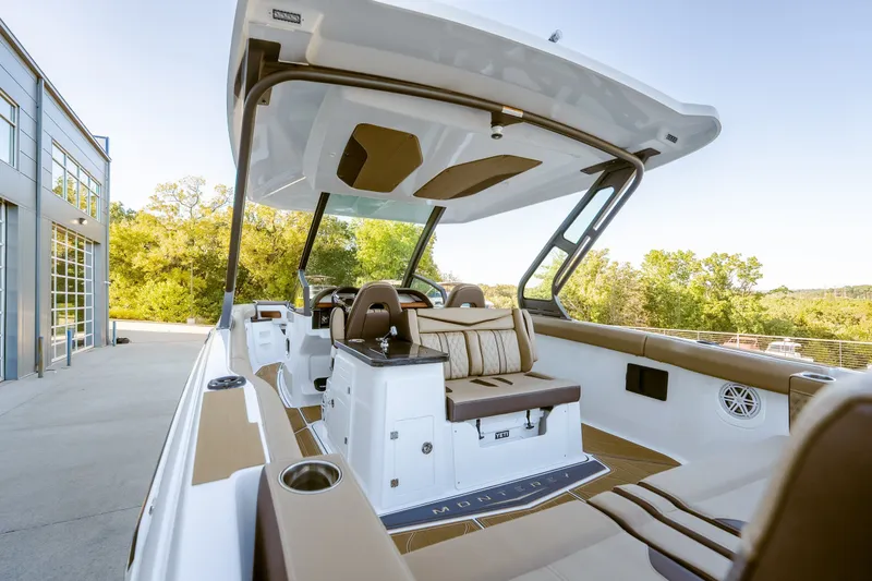 Slide: The Image of 2027 Monterey Elite 30 OB boat interior with luxurious seating and modern design. - 16