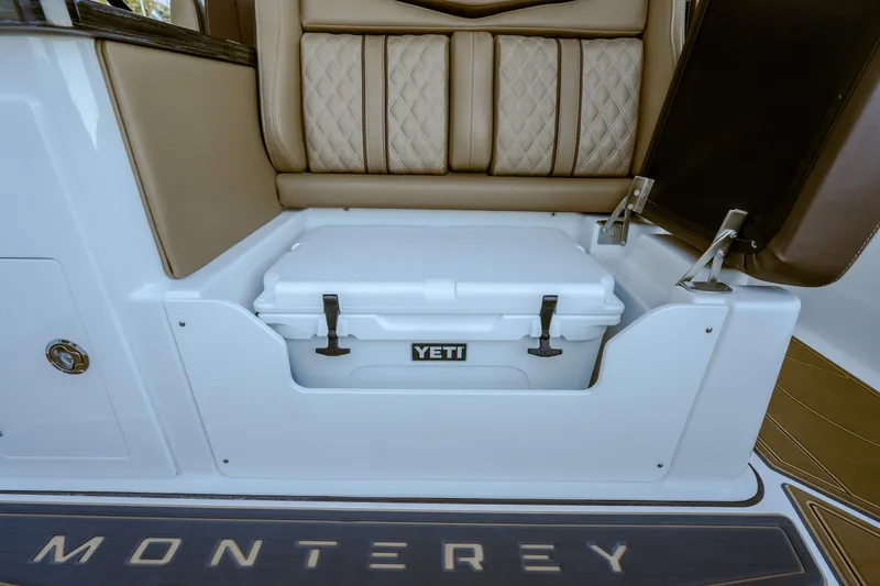 Slide: The Image of 2027 Monterey Elite 30 OB boat seat with integrated Yeti cooler storage. - 24