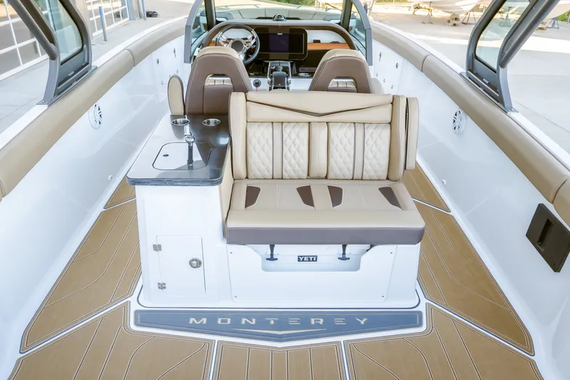 Slide: The Image of Luxurious interior of 2027 Monterey Elite 30 OB boat with elegant seating and modern design. - 17