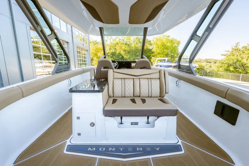 Slide: The Image of Luxurious interior of 2027 Monterey Elite 30 OB boat with elegant seating and modern design. - 19