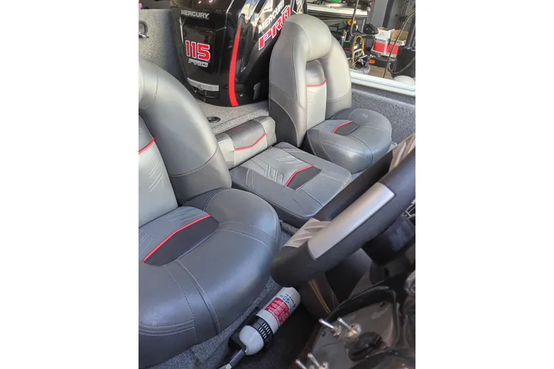 Slide: The Image of 2023 TRACKER PRO190 boat interior with gray seats and Mercury 115 engine. - 14
