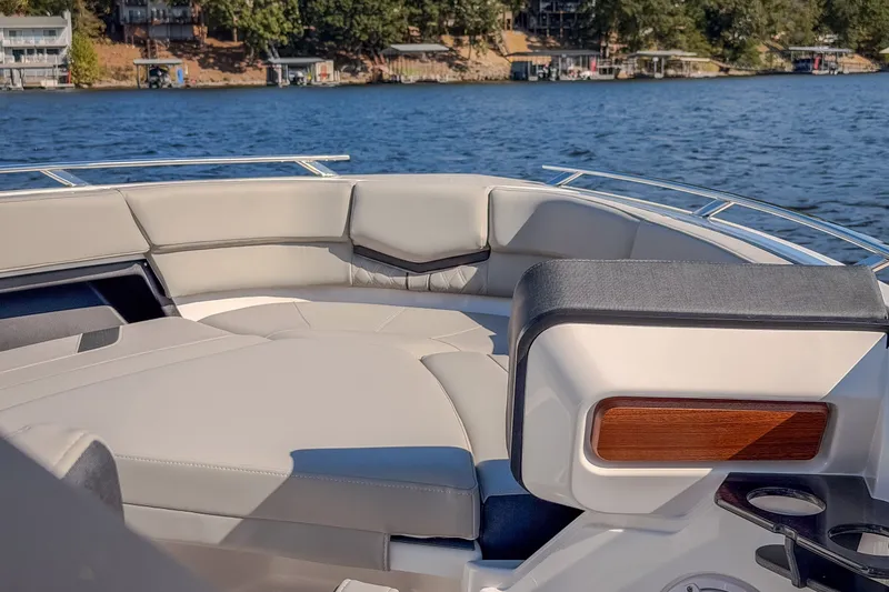 Slide: The Image of Luxurious seating on a 2027 Monterey Elite 27 OB boat, with scenic lake view. - 54