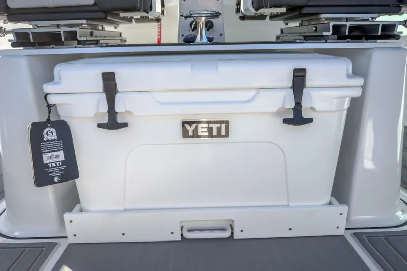 Slide: The Image of YETI cooler on 2027 Monterey Elite 27 OB boat deck. - 14
