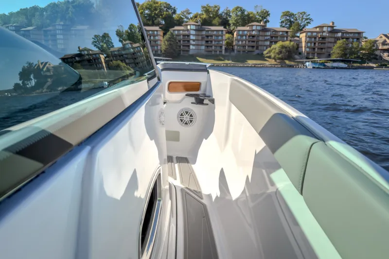 Slide: The Image of 2027 Monterey Elite 27 OB boat interior with scenic waterfront view. - 31
