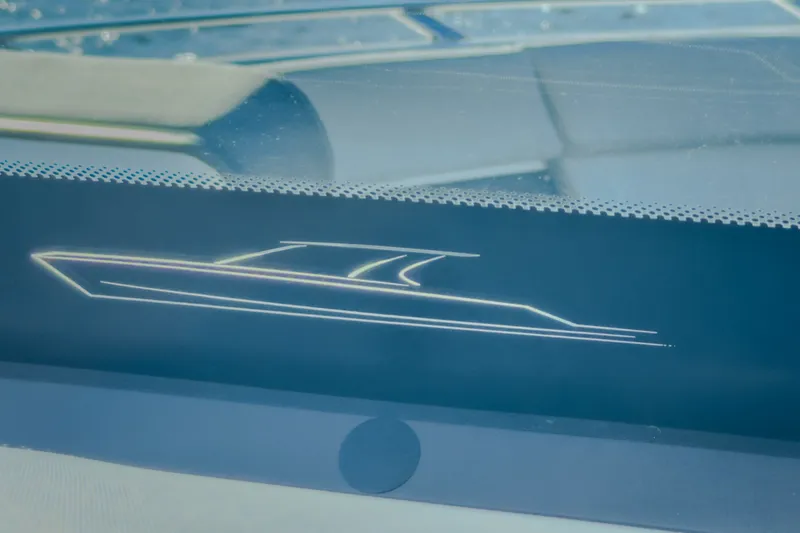 Slide: The Image of Stylized outline of a 2027 Monterey Elite 27 OB boat on a display screen. - 49