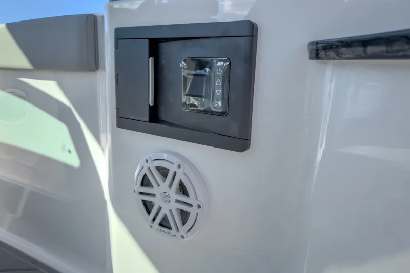 Slide: The Image of Control panel and speaker on 2027 Monterey Elite 27 OB boat. - 48