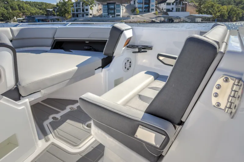 Slide: The Image of Luxury seating on 2027 Monterey Elite 27 OB boat, featuring sleek design and waterfront view. - 63