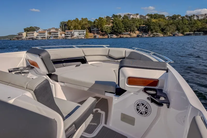 Slide: The Image of Luxurious 2027 Monterey Elite 27 OB boat interior with comfortable seating on a scenic lake. - 53
