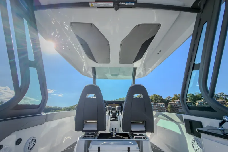 Slide: The Image of Interior view of 2027 Monterey Elite 27 OB boat with modern seating and sunroof. - 38