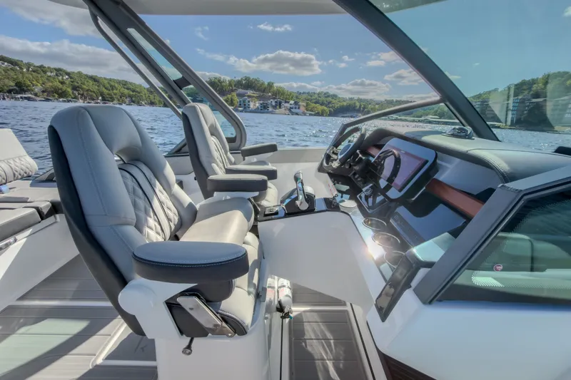Slide: The Image of Luxurious interior of 2027 Monterey Elite 27 OB boat with modern dashboard and seating. - 43