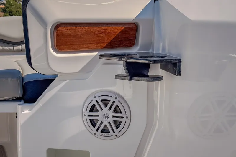 Slide: The Image of 2027 Monterey Elite 27 OB boat interior with speaker and cup holder detail. - 55