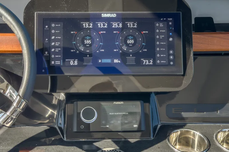 Slide: The Image of Dashboard of a 2027 Monterey Elite 27 OB boat with Simrad display and controls. - 41