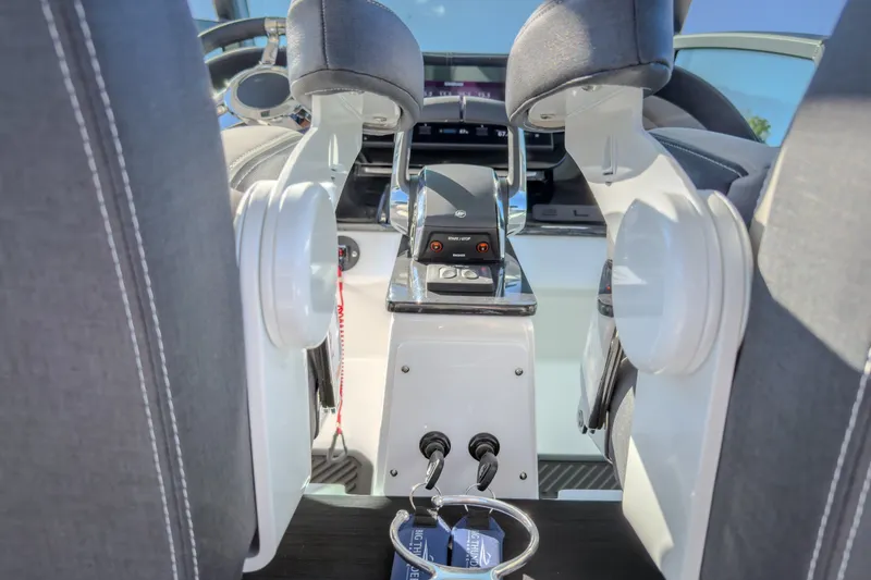 Slide: The Image of Interior view of 2027 Monterey Elite 27 OB boat cockpit with modern controls. - 28