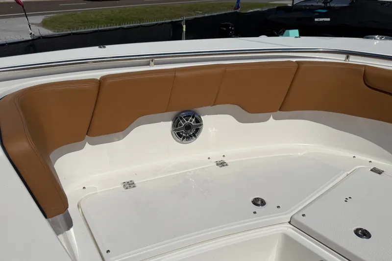 Slide: The Image of 2025 Robalo R302 Center Console boat with tan seating and stainless steel speaker. - 43