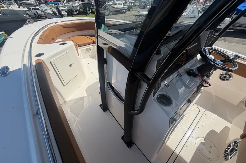 Slide: The Image of 2025 Robalo R302 Center Console boat interior with sleek design and modern features. - 38