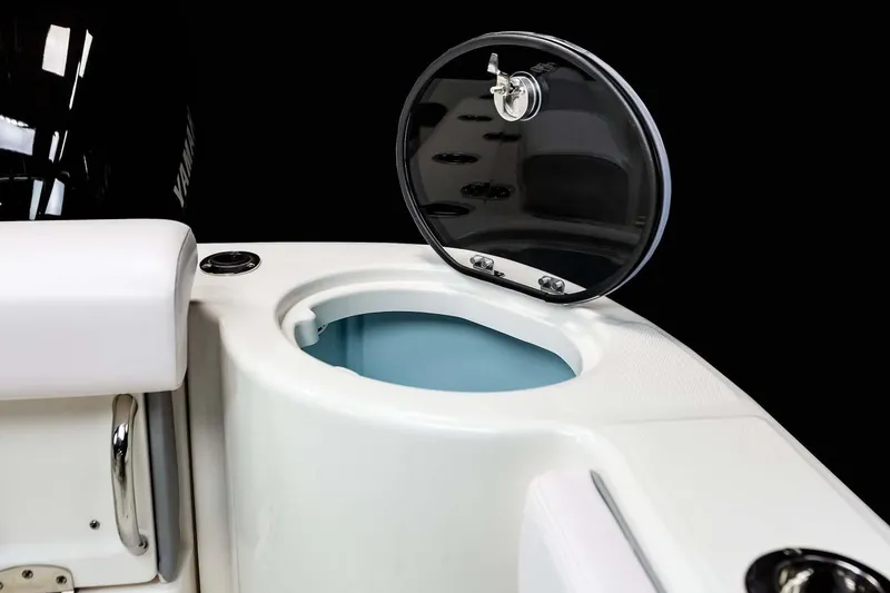 Slide: The Image of Manufacturer Provided Image: 2025 Robalo R302 Center Console boat with open storage compartment. - 17