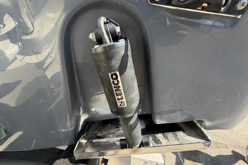 Slide: The Image of Close-up of Lenco trim tab actuator on 2025 Robalo R302 Center Console boat. - 8