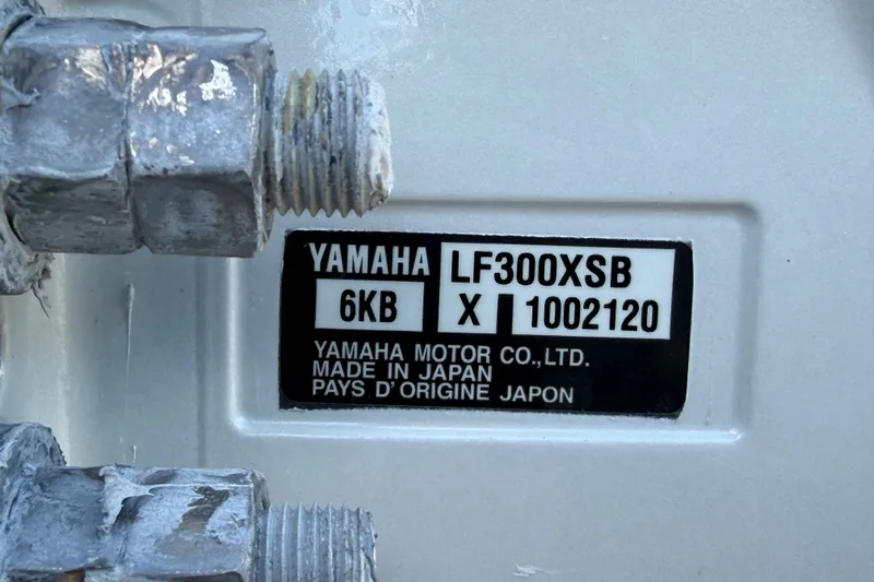 Slide: The Image of Yamaha LF300XSB engine label on 2025 Robalo R302 Center Console boat. - 90
