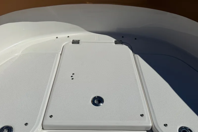 Slide: The Image of 2025 Robalo R302 Center Console boat deck with storage hatch and sleek design. - 46
