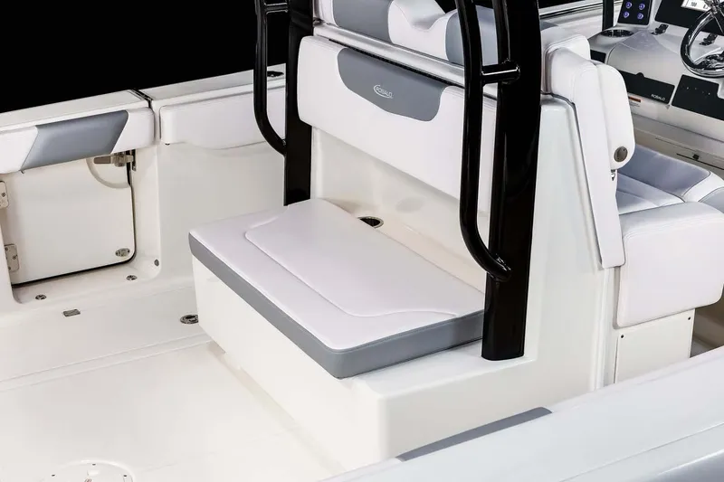 Slide: The Image of Manufacturer Provided Image: 2025 Robalo R302 Center Console boat interior with cushioned seating and sleek design. - 15