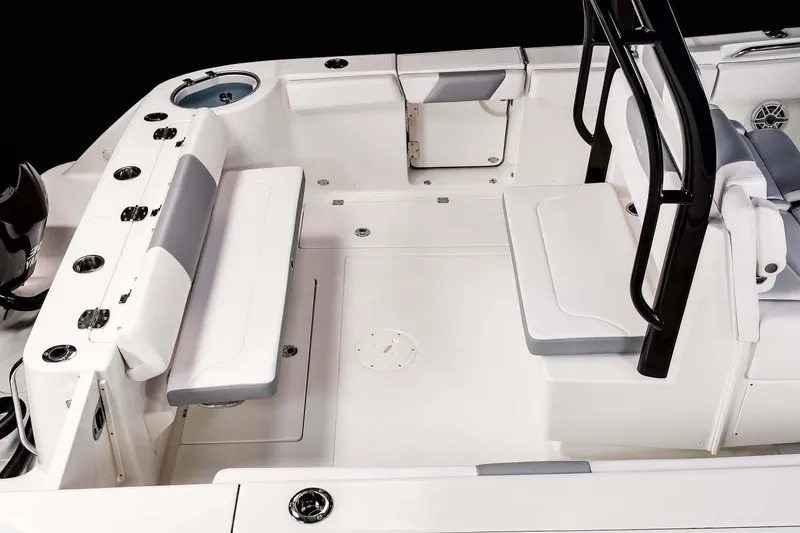 Slide: The Image of Manufacturer Provided Image: 2025 Robalo R302 Center Console boat interior with seating and fishing rod holders. - 16