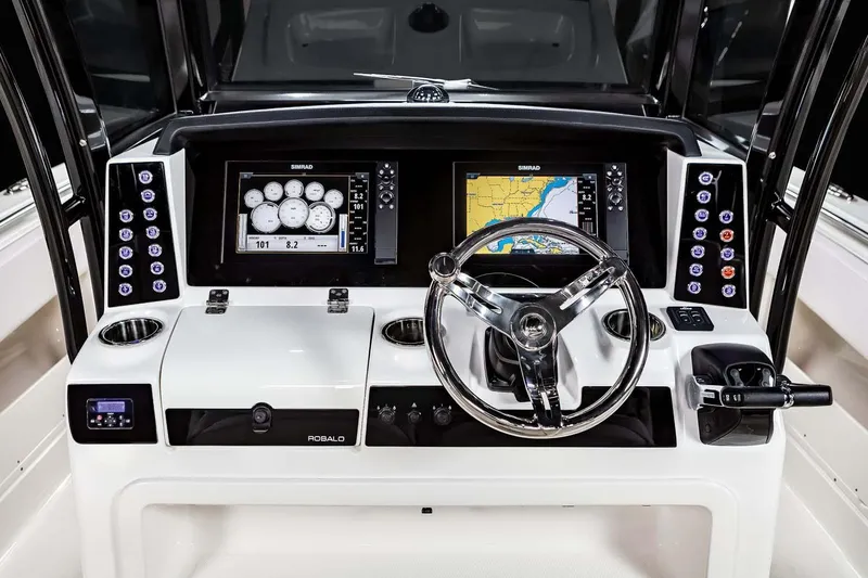 Slide: The Image of Manufacturer Provided Image: 2025 Robalo R302 Center Console dashboard with dual displays and modern controls. - 13